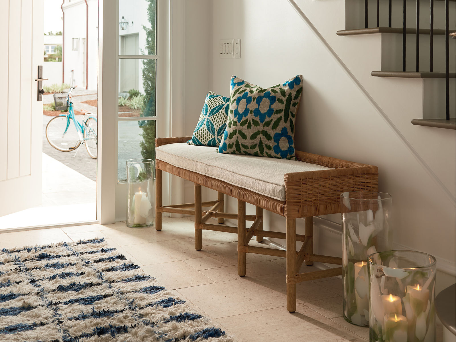 Bench with blue pillows on it