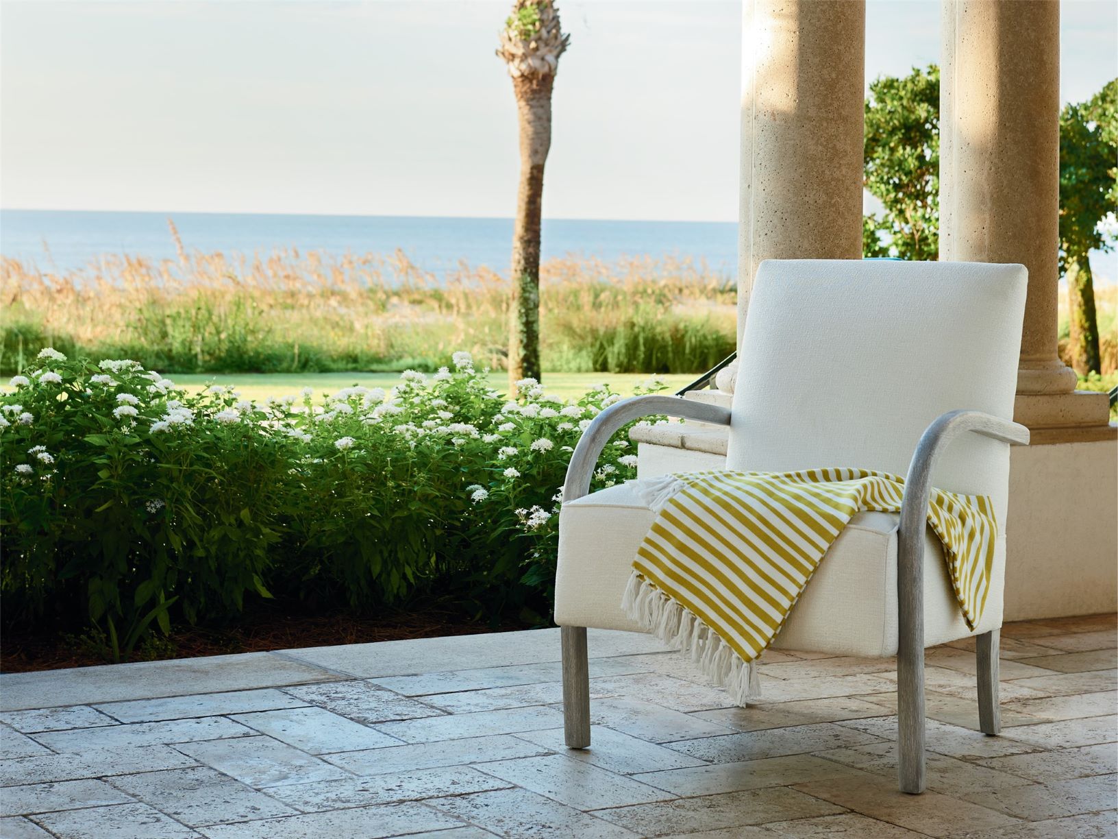 Chair on a porch overlooking the ocean