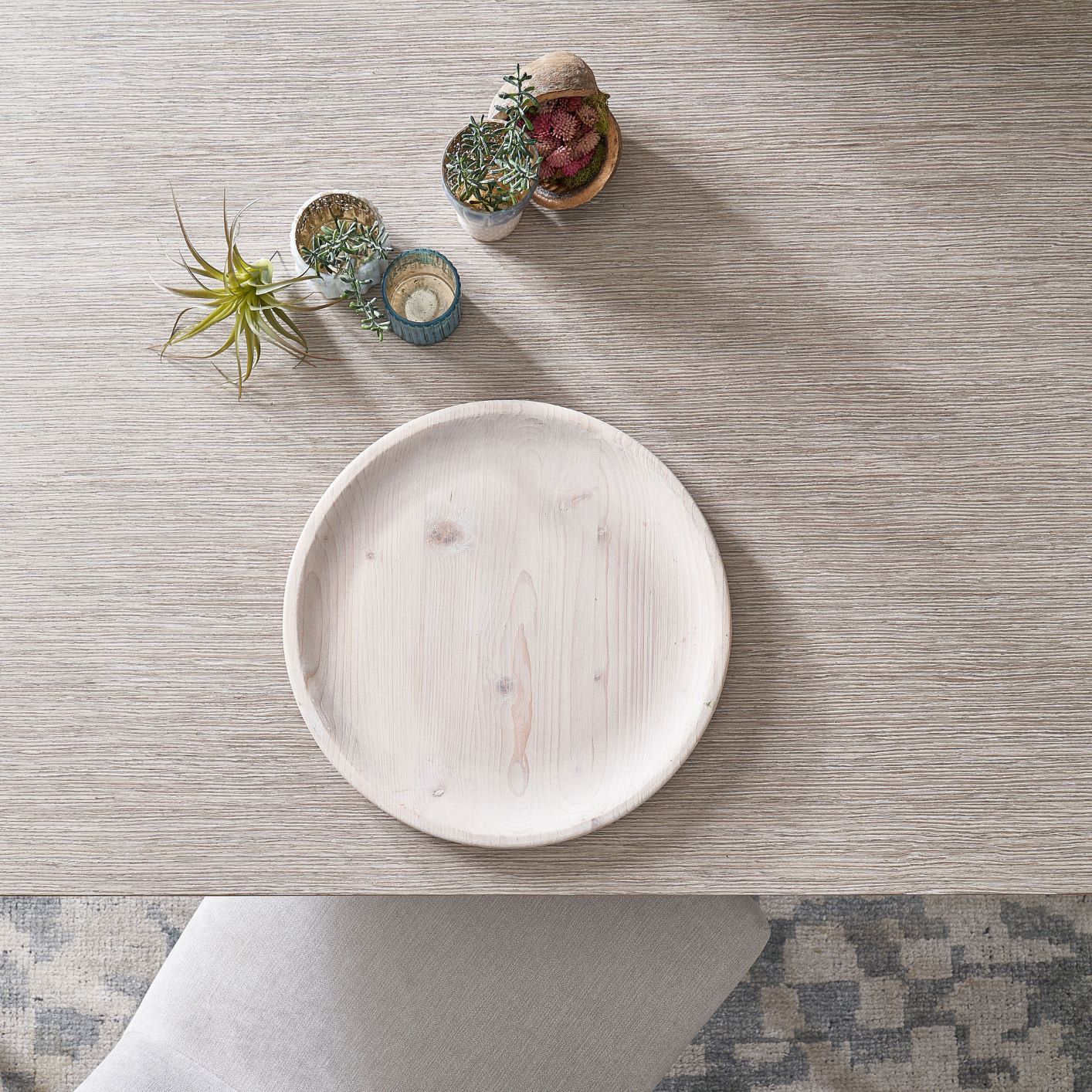 Image of greenery and charger on a dining room table