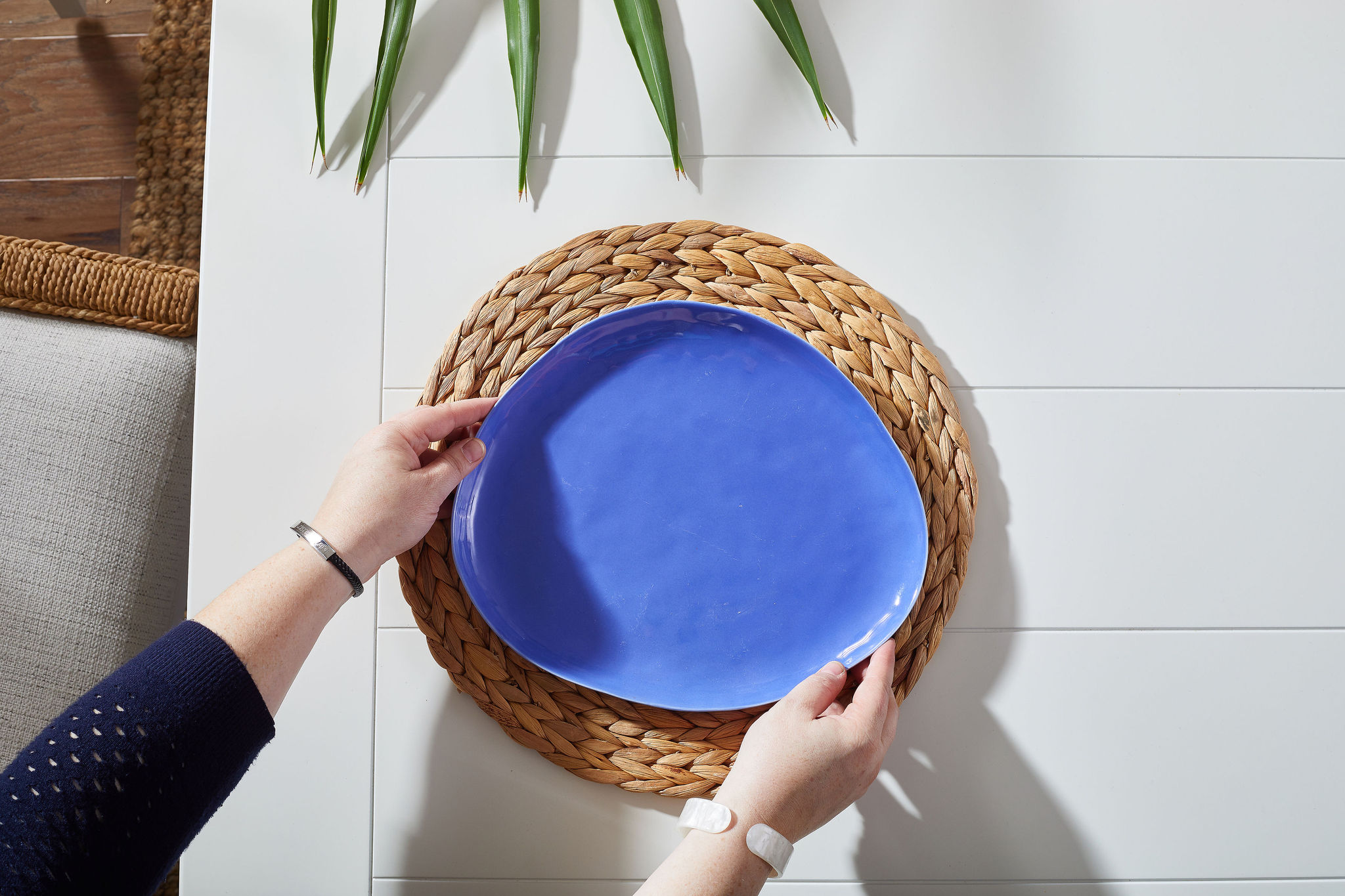 Woven placemat with a blue plate on top