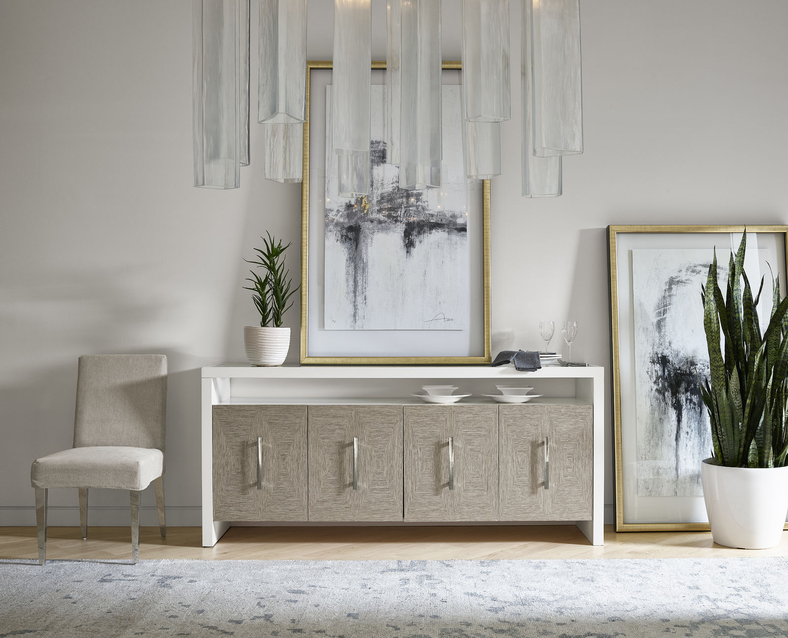 Dining room sideboard with art resting on top