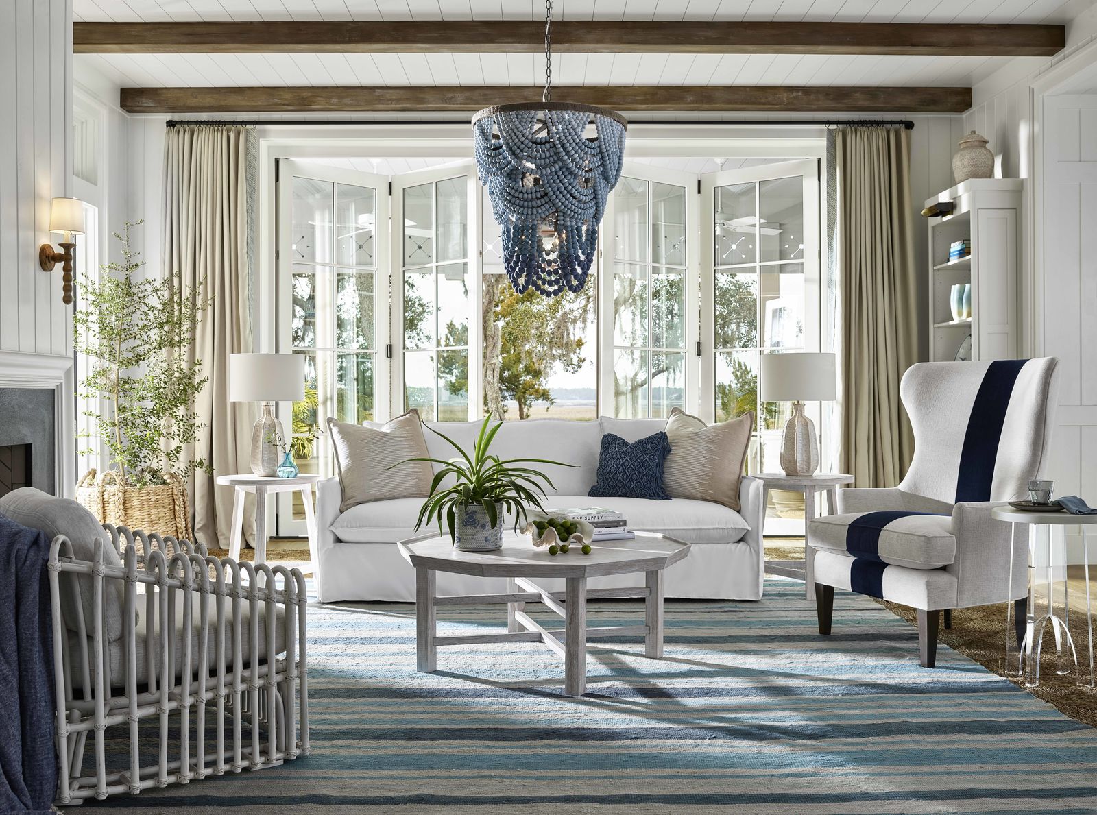 living room with white sofa and blue chandelier
